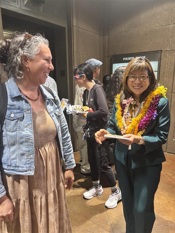 Councilmember Tamara Paltin greets House Speaker Nadine K. Nakamura