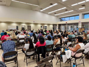 Crowd seated at Kihei budget meeting in 2025.