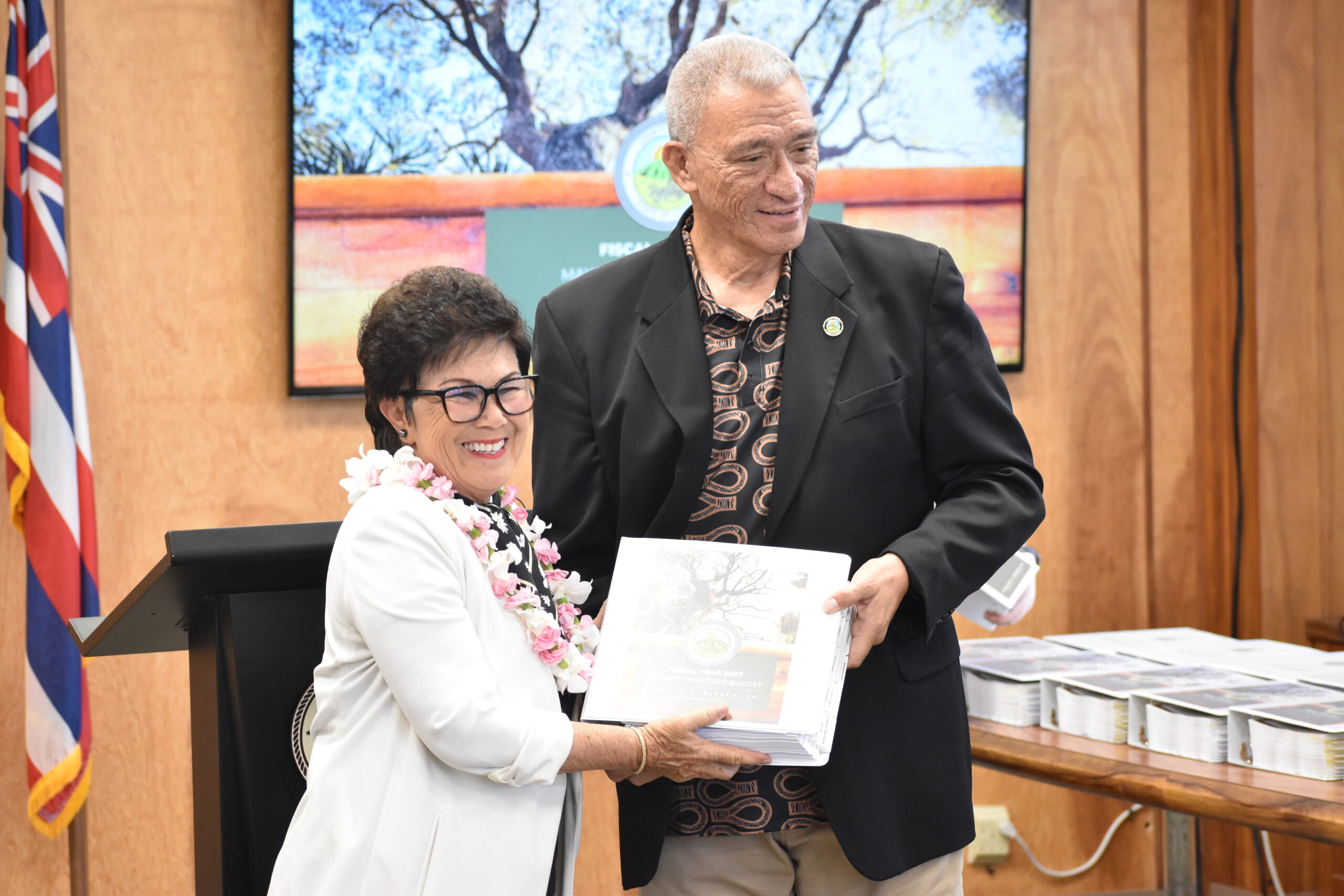 Chair Lee is handed a copy of the FY 2027 Mayorʻs Proposed Budget.