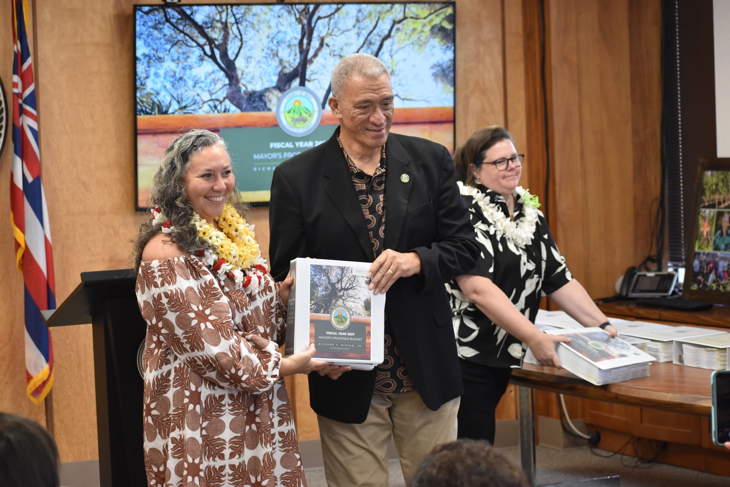 Councilmember Paltin is handed a copy of the FY 2027 Mayor's Proposed Budget 